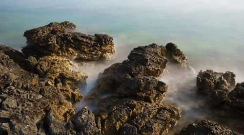 Scenic view of rocks in sea