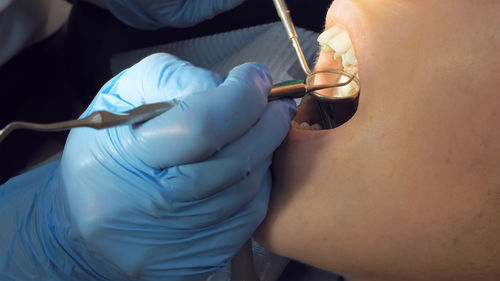 Dentist examining patient