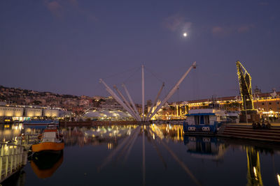 Boats moored at harbor