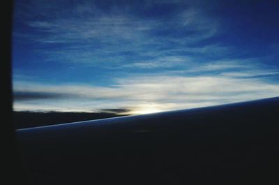 Scenic view of landscape against cloudy sky