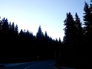 Silhouette trees against clear sky