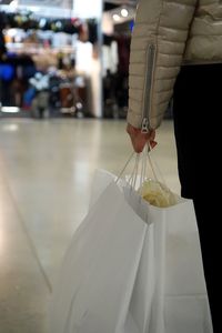 Close-up of hand holding ice cream hanging