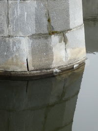 Reflection of building in puddle
