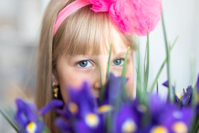 Close-up portrait of girl with flower