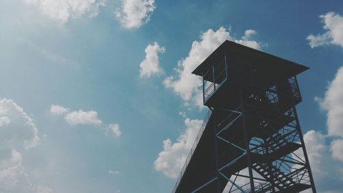 Low angle view of built structure against cloudy sky