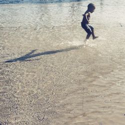 High angle view of boy on beach