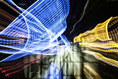 Digital composite image of light trails in city at night