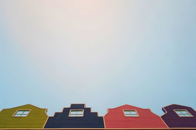 Low angle view of buildings against clear sky