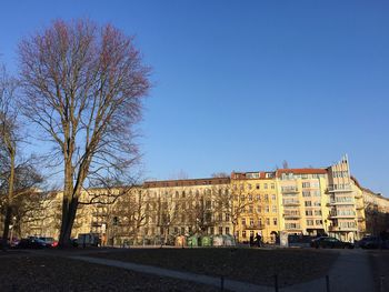 Buildings against clear blue sky