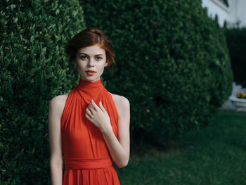 Portrait of a young woman standing outdoors