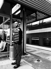 Man in train at railroad station