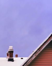 Cropped structure on snow against the sky