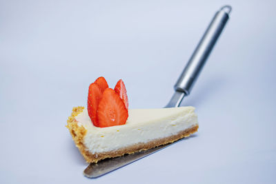 Close-up of dessert on plate against white background