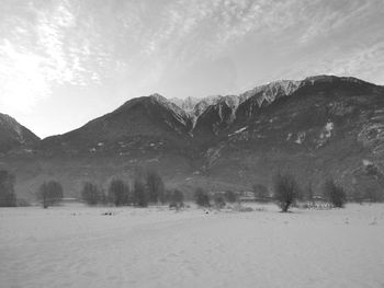 Scenic view of snowcapped mountains against sky