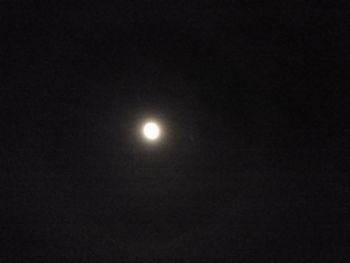 Low angle view of moon against sky at night