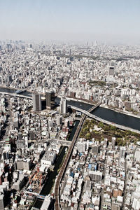 High angle view of crowd on street amidst buildings in city