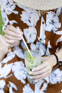 Midsection of woman holding ice cream