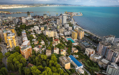 High angle view of townscape by sea