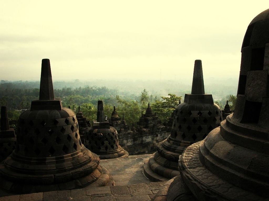 religion, place of worship, spirituality, temple - building, ancient, history, ancient civilization, famous place, travel destinations, stupa, tourism, travel, built structure, borobudur temple, the past, architecture, culture, sky, international landmark