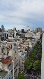 High angle view of buildings in city against sky