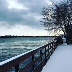 Scenic view of sea against sky during winter