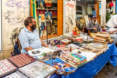 Men working at market stall