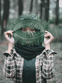 Cropped hand of woman wearing hat