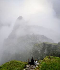 Scenic view of mountains in foggy weather