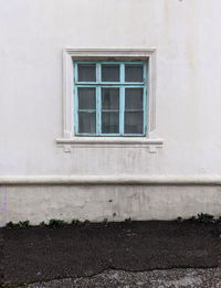 Low angle view of window on wall of building