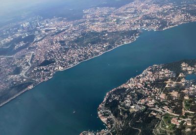 Aerial view of city by sea