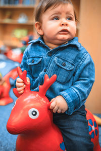 Portrait of cute baby at home