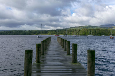 Pier over sea against sky