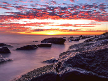 Scenic view of sea against sky during sunset