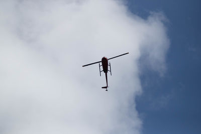 Low angle view of airplane against sky