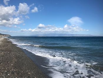 Scenic view of sea against blue sky