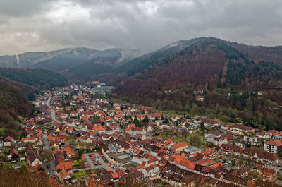 High angle view of houses and mountains against sky