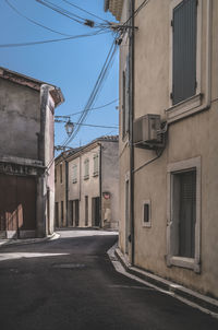 Street amidst buildings against sky