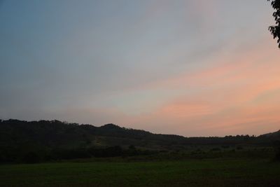 Scenic view of field against sky during sunset