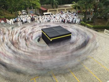 High angle view of people walking on road