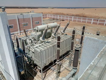 High angle view of machine by sea against sky