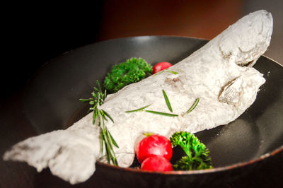 Trout fish coated in flour ready to be fried