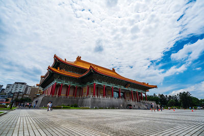 View of temple building against cloudy sky