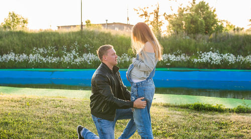 Rear view of couple kissing in lake