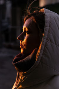 Close-up of young woman standing outdoors