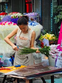 Woman holding flower bouquet