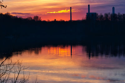 Scenic view of lake against romantic sky at sunset