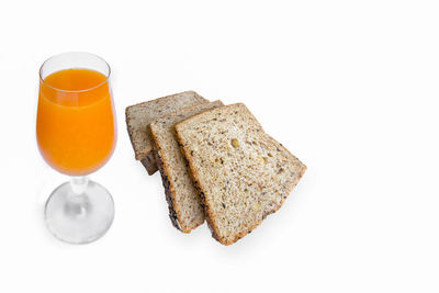 High angle view of breakfast on table against white background