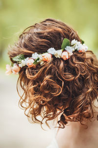 Close-up of woman wearing flowers