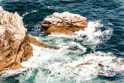 Scenic view of rocks in sea