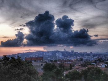 High angle view of buildings against sky at sunset